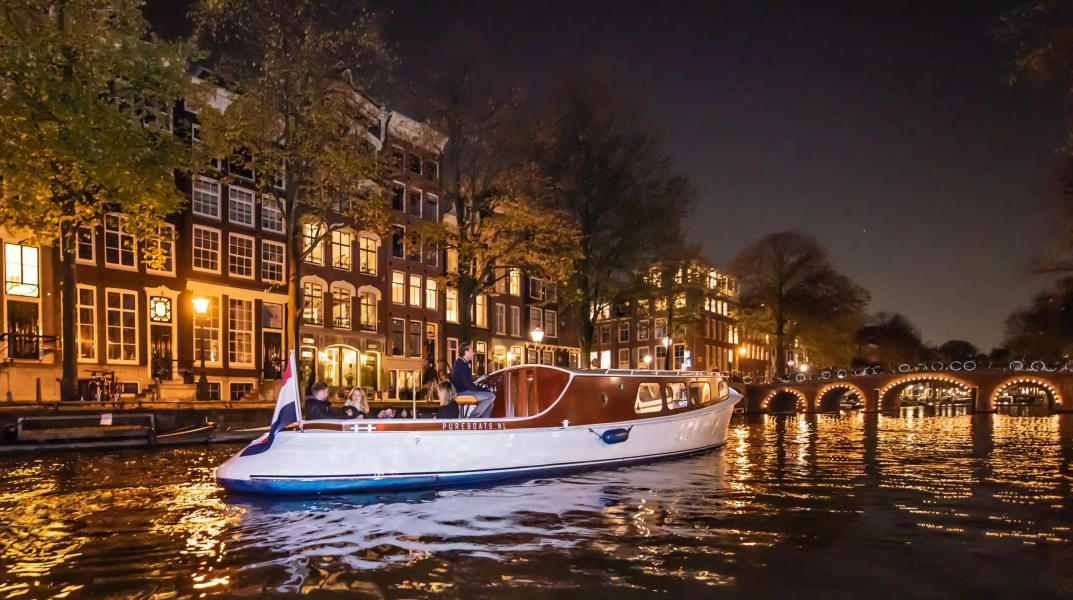 Take in the scenic beauty of the evening in the Amsterdam