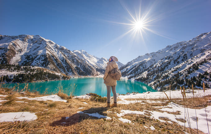 Tourist admring the beauty of Almaty Lake