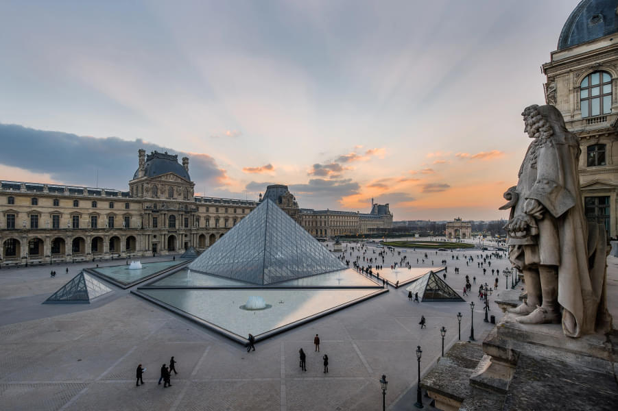Come across renowned attractions such as the Louvre Museum during your tour
