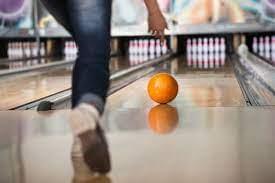 Test your precision and strength as you toss the ball