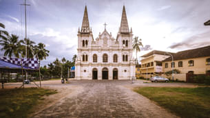 Admire the intricate Gothic architecture and vibrant frescoes of Santa Cruz Cathedral Basilica