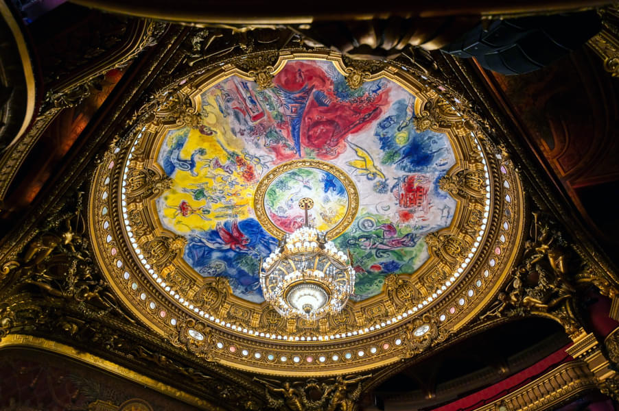 Watch the seven-ton chandelier hanging from the ceiling
