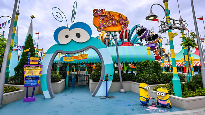 Spin into fun on Silly Swirly, a whimsical ride with colorful gondolas and Minion-themed tunes