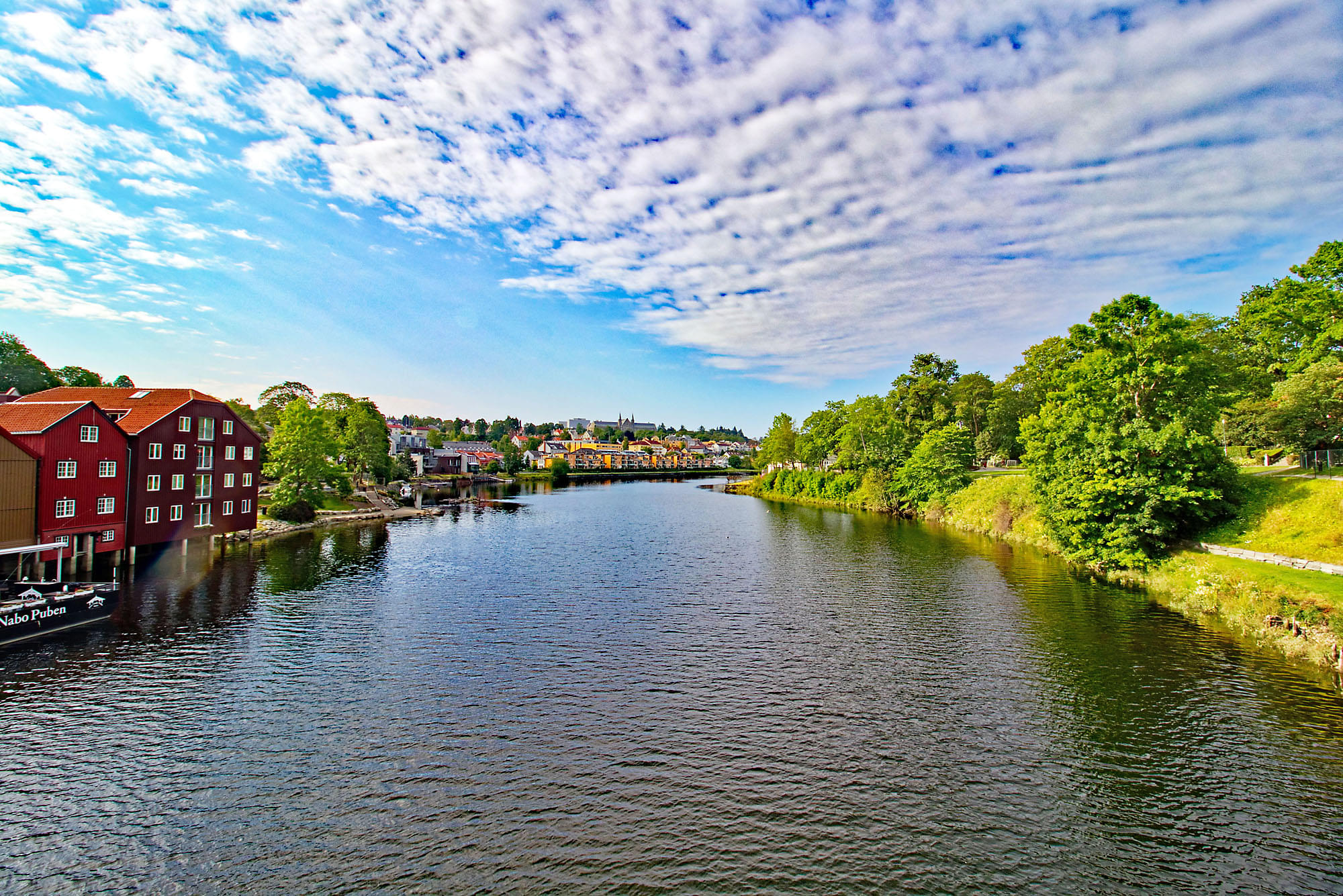 Soak in the stunning views of Nidelva River and Wharves