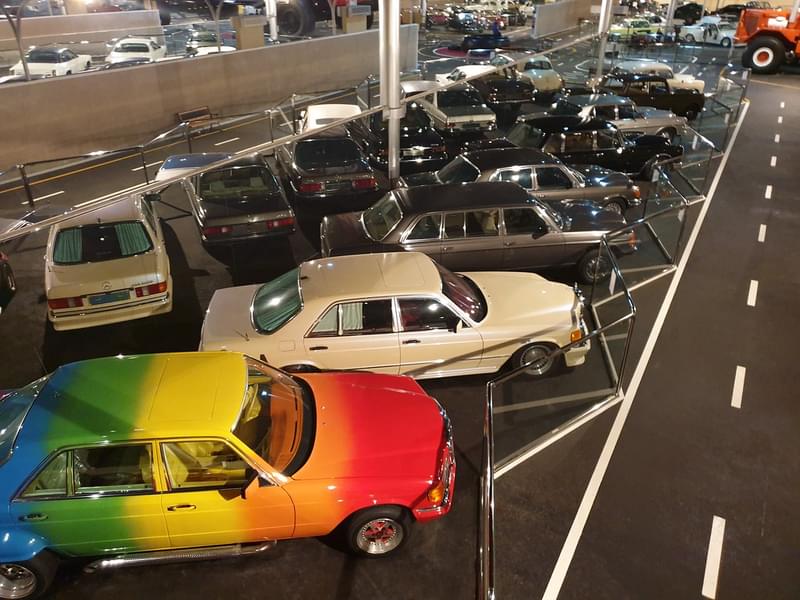 A unique set of cars such as the rainbow car.