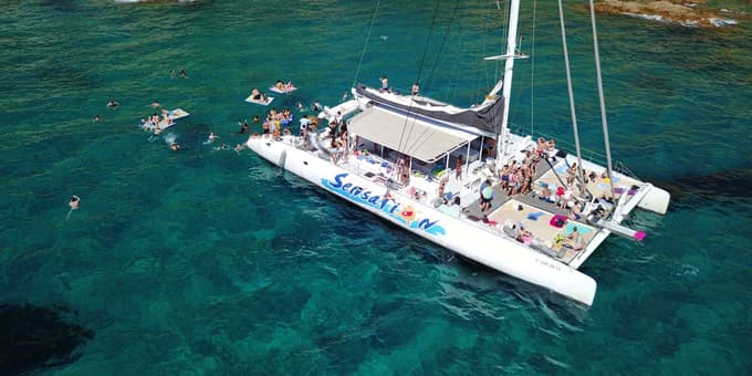 Board a large catamaran with your friends for utmost fun