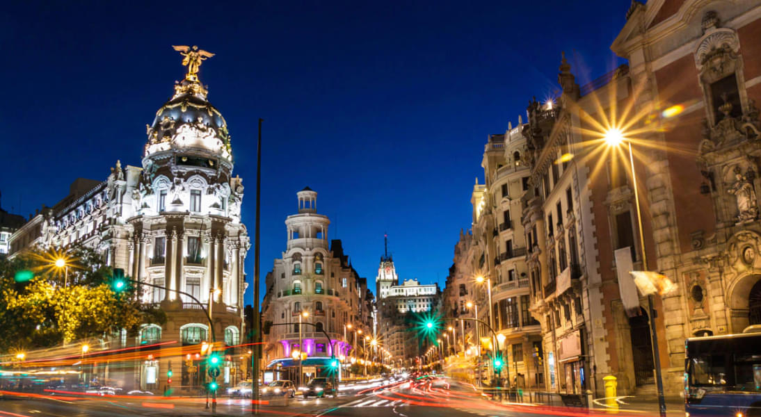 Get a glimpse of beautiful buildings in the Calle Gran Vía