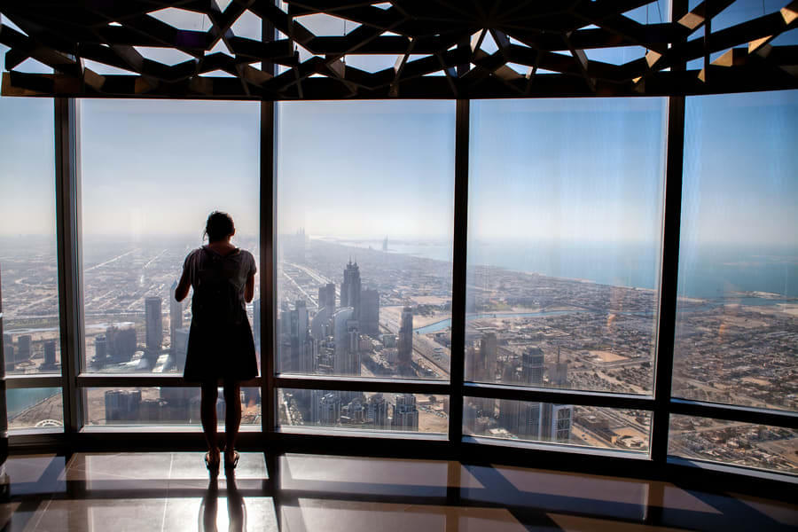 Capture magnificent views from the floor-to-ceiling glass walls of Burj Khalifa's 124th floor