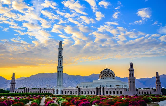 Marvel at the stunning architecture of Sultan Qaboos Grand Mosque
