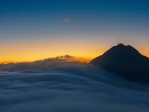 Witness a mesmerizing sunrise from the lantau peak