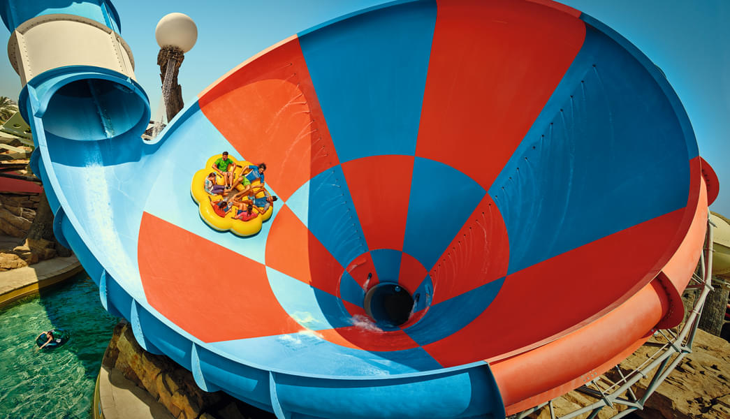 Go down the world's largest six-person water slide at Yas Waterworld