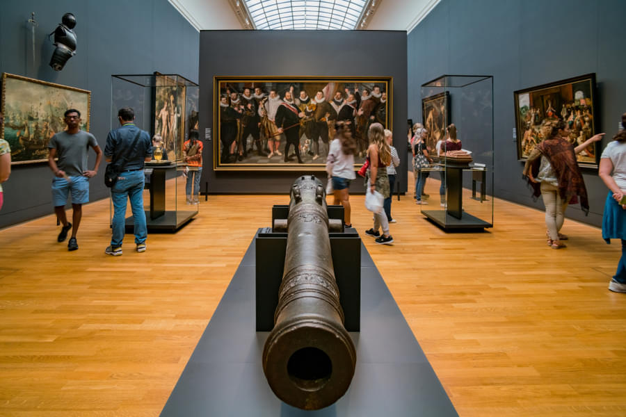 Individuals Viewing Art at the Rijksmuseum