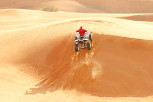 Feel the adrenaline rush as you ride an atv on the sand dunes