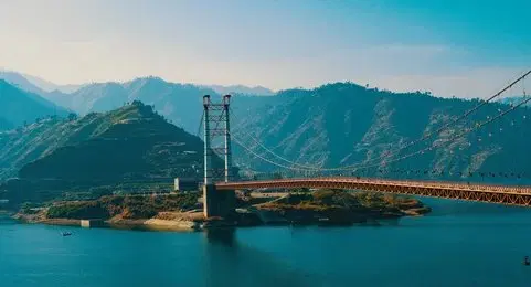 Cross the Dobra–Chanti Suspension Bridge