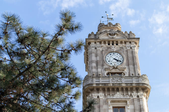 The Clock Tower In Dolmabahce Palace Garden