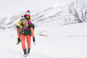Couple having fun in snow in Manali during winters