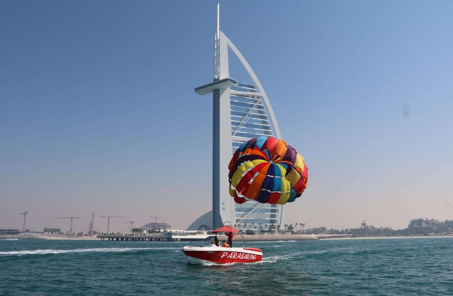 See the iconic monuments and infrastructure of Dubai while parasailing