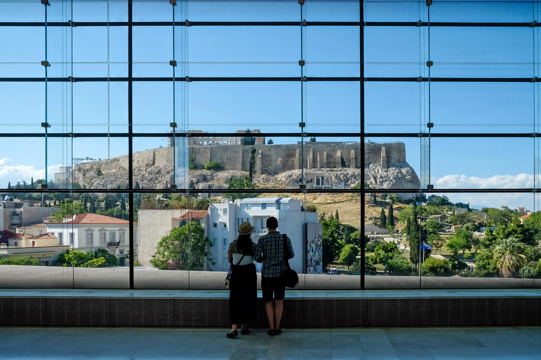 Delve into the ancient history of the city while watching the old Acropolis