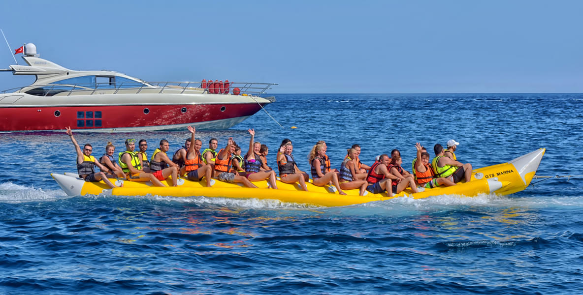 Go for a fun and thrilling banana boat ride with life jackets on