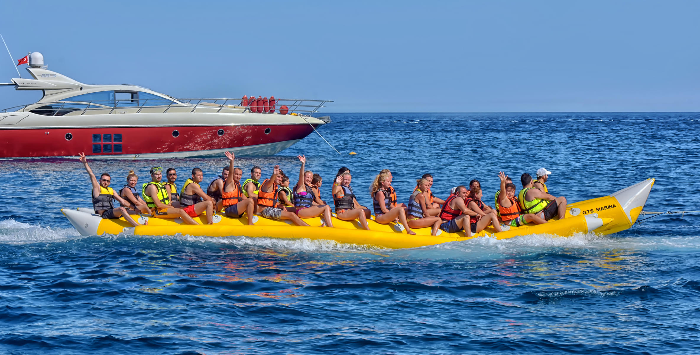 Go for a fun and thrilling banana boat ride with life jackets on