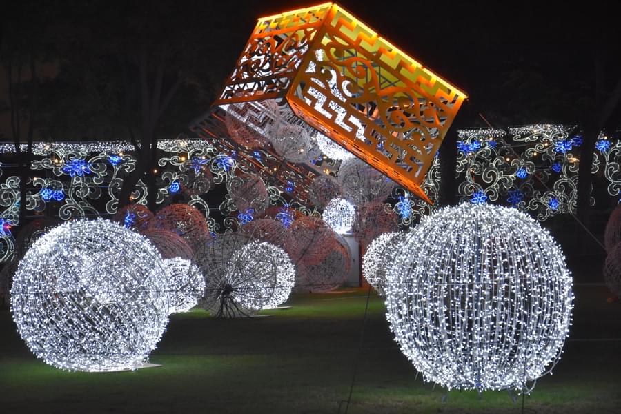Take in the beauty of the decorative lights and shapes all around the garden