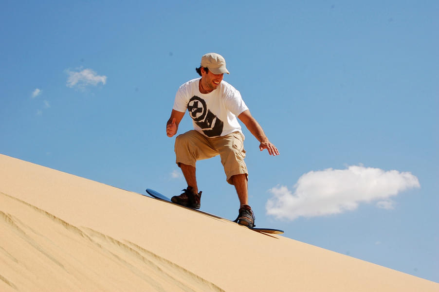 Catch the perfect wave-on sand with the Sandboarding in Dubai experience.
