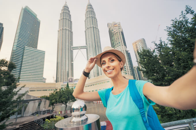 Capture a best selfie for Instagram with the iconic Twin Towers in the background