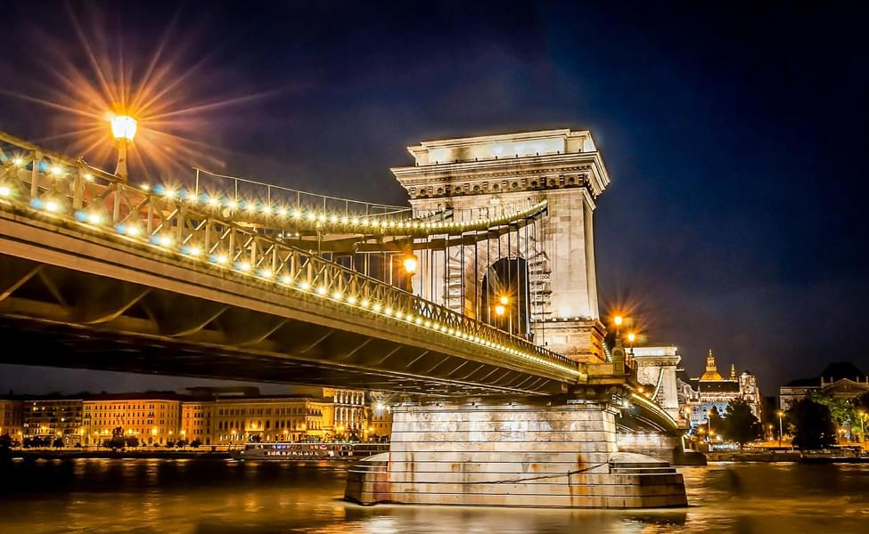 Witness the majestic Chain Bridge as you pass by it