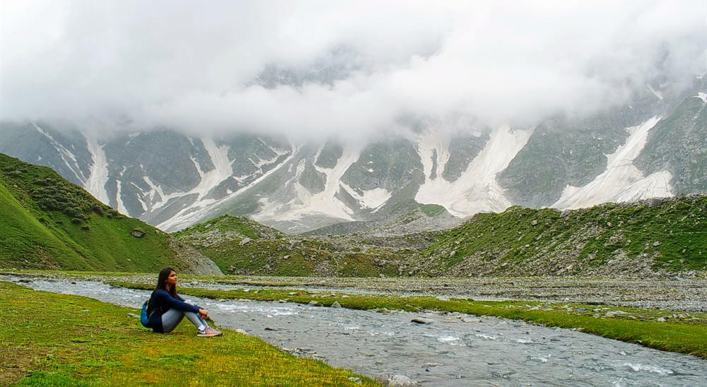 Sit next to a roaring rapid and behold nature’s tranquility amidst the gorgeous Himalayas.