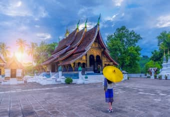 Admire the stunning architecture of Wat Xieng Thong in Luang Prabang