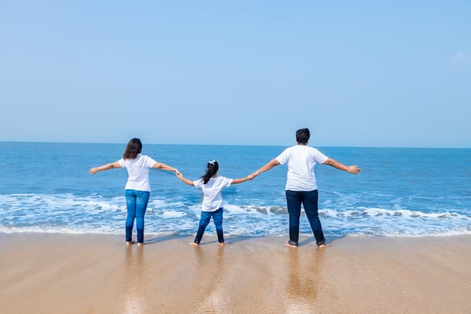 Family enjoying at a beach in Kerala