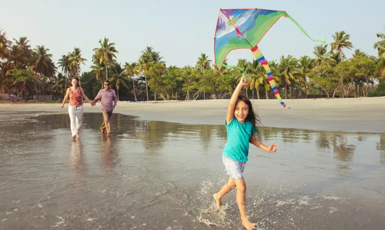 Family enjoying at the beach, Kerala