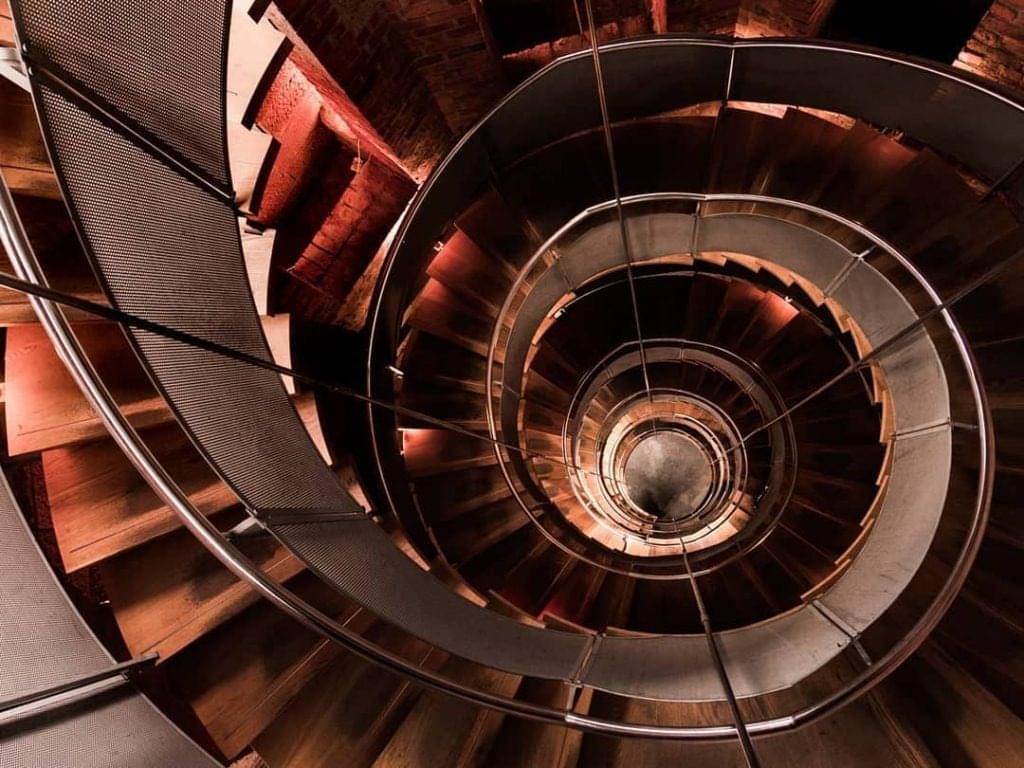 Climb up the lighthouse's spiralling staircase