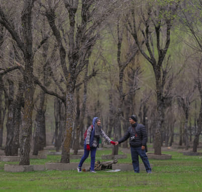 Tourist enjoying scenic view of the Betaab Valley, Kashmir
