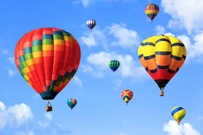 Enjoying breathtaking views from a hot air balloon ride over the city.