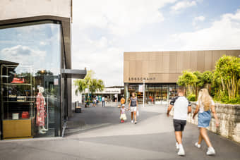 Visitors shopping at OUTLETCITY 