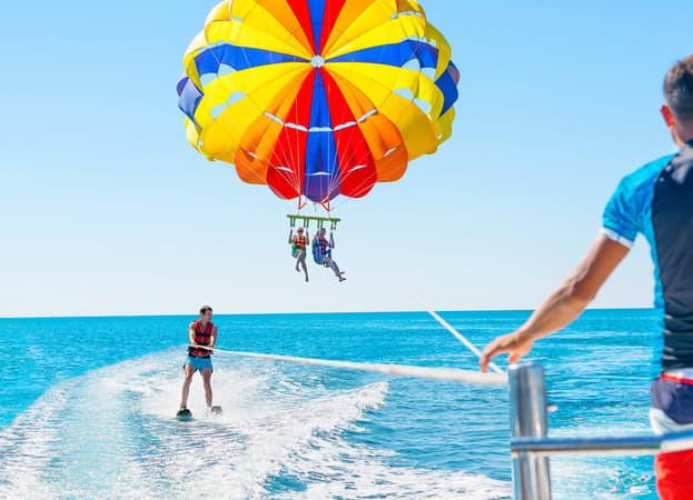 Enjoy parasailing adventure on the azure waters