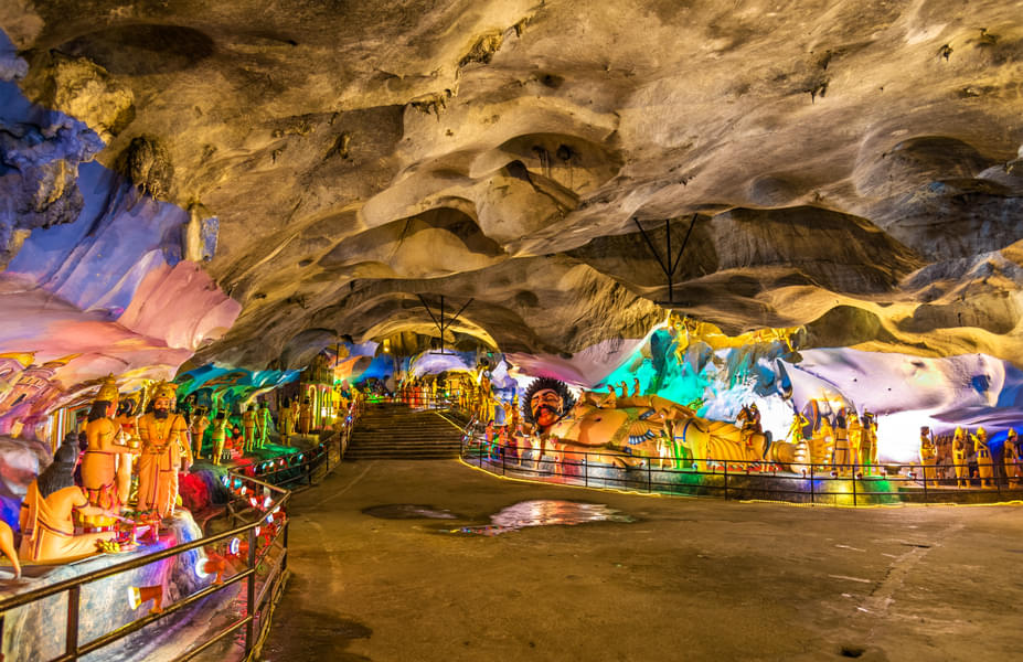 Admire the beautiful statues inside the Batu Caves
