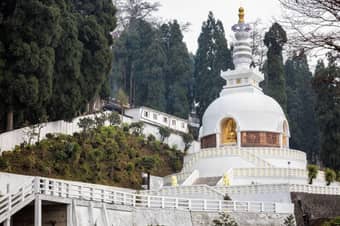 Experience the calming atmosphere of Peace Pagoda, offering views of the Himalayas