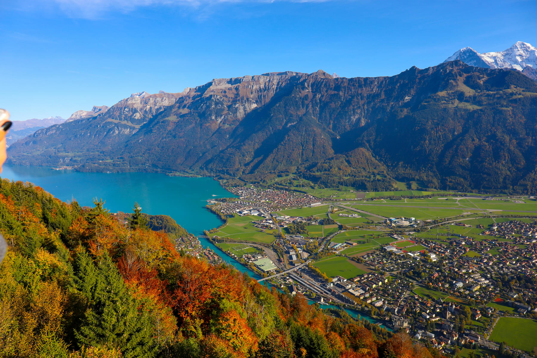 Get a panoramic view of the lush green landscape & sapphire-blue lakes - Brienz and Thun