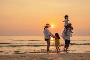 Family enjoying at a beach in Kerala