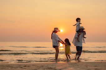 Family enjoying at a beach in Kerala