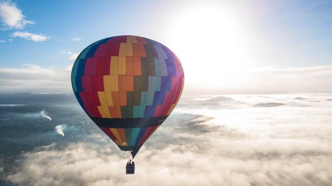 Hot air balloon soars above the clouds in Dubai