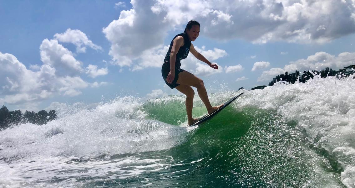 Stand on the wakesuf board and get unique experience of surfing