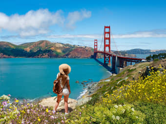 Girl at the famous Golden Gate Bridge San Francisco