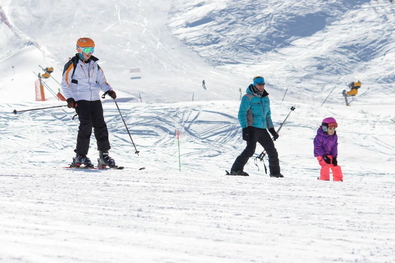 Skiers enjoying a snowy slope at a winter resort in Azerbaijan.