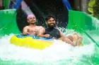 Feel the adrenaline rush with high-speed drops and twisting water tunnels