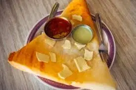 Try Ghee Dosa and Thatte Idli at Sri Vasavi Mane Thindi