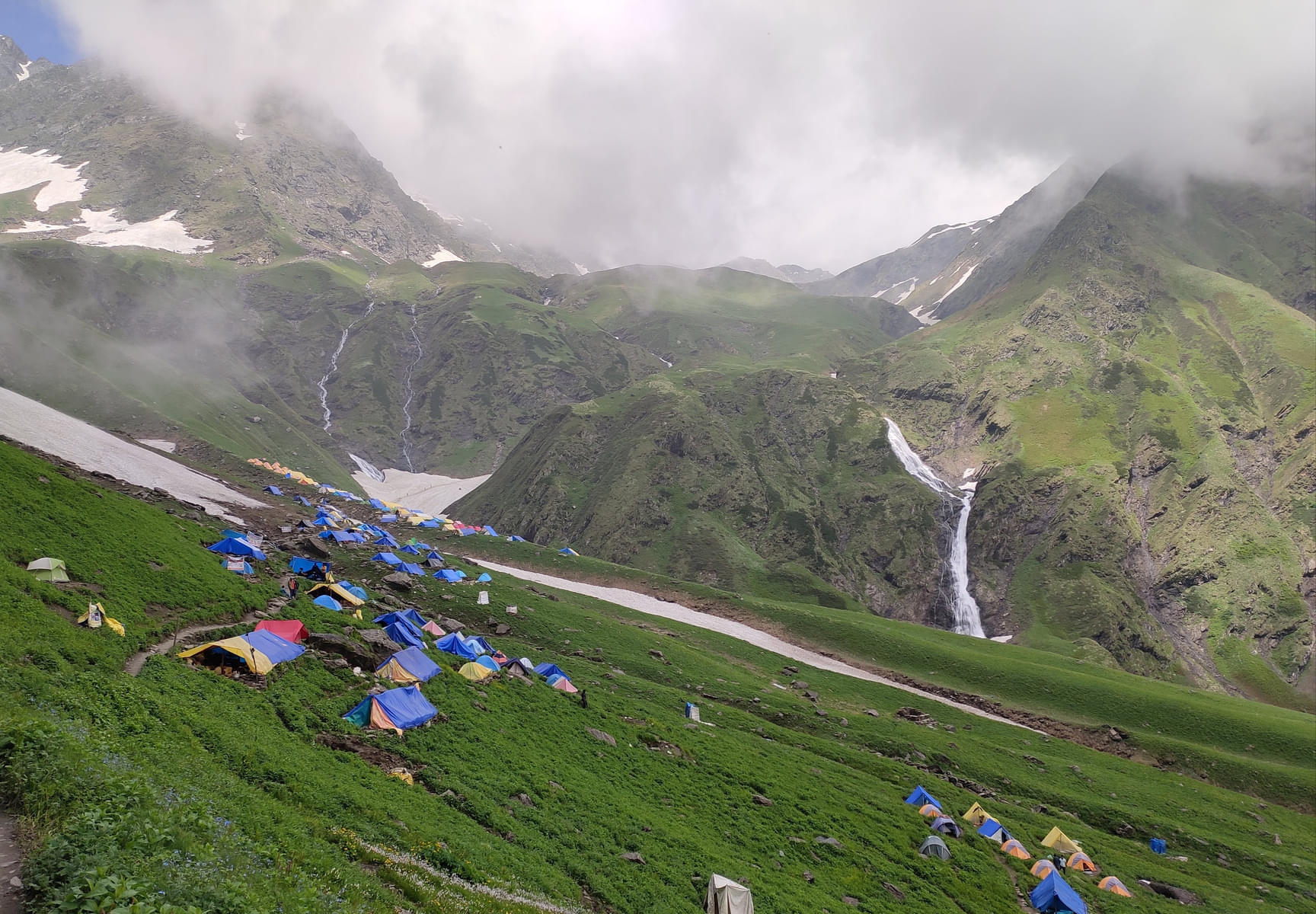Experience the adventure of camping under the stars, amidst snow-covered valleys