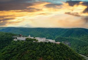 Enjoy breathtaking views of Choolgiri Hills from the temple located on the hilltop
